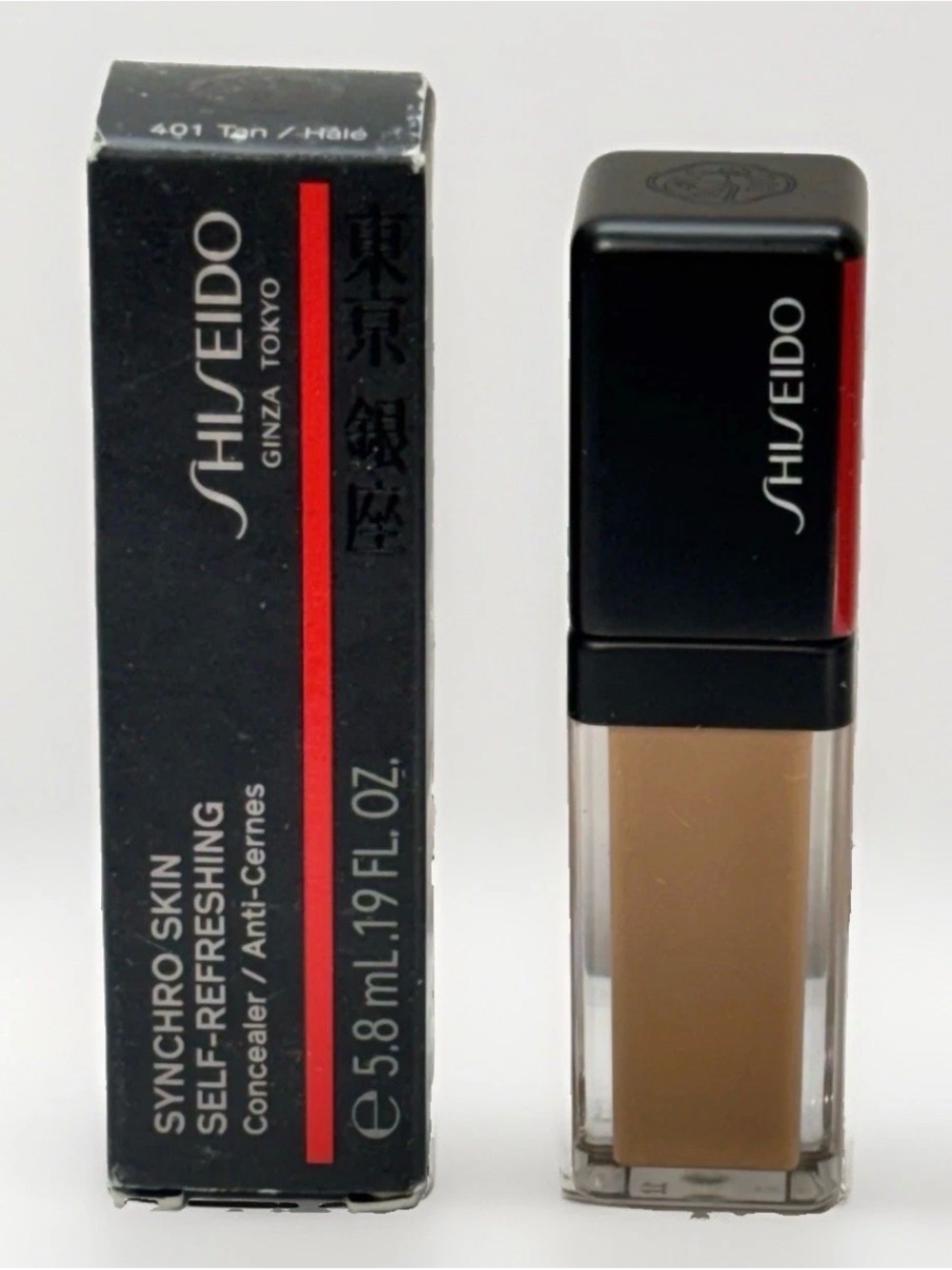 Shiseido Concealer in Tan with Black Cap and Red Accent